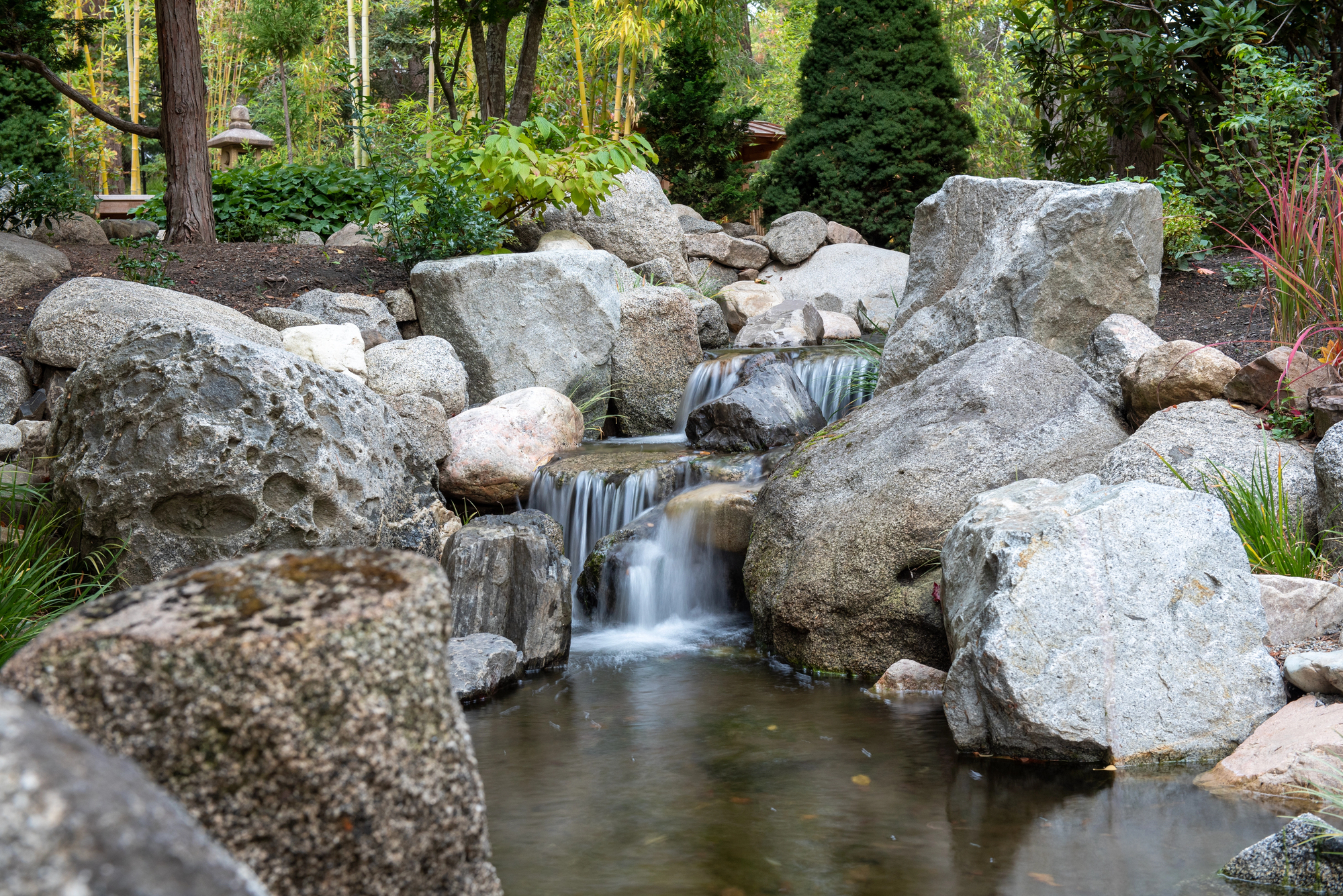 Peaceful stone waterfall and zen garden at Ashland Oregon retreat center