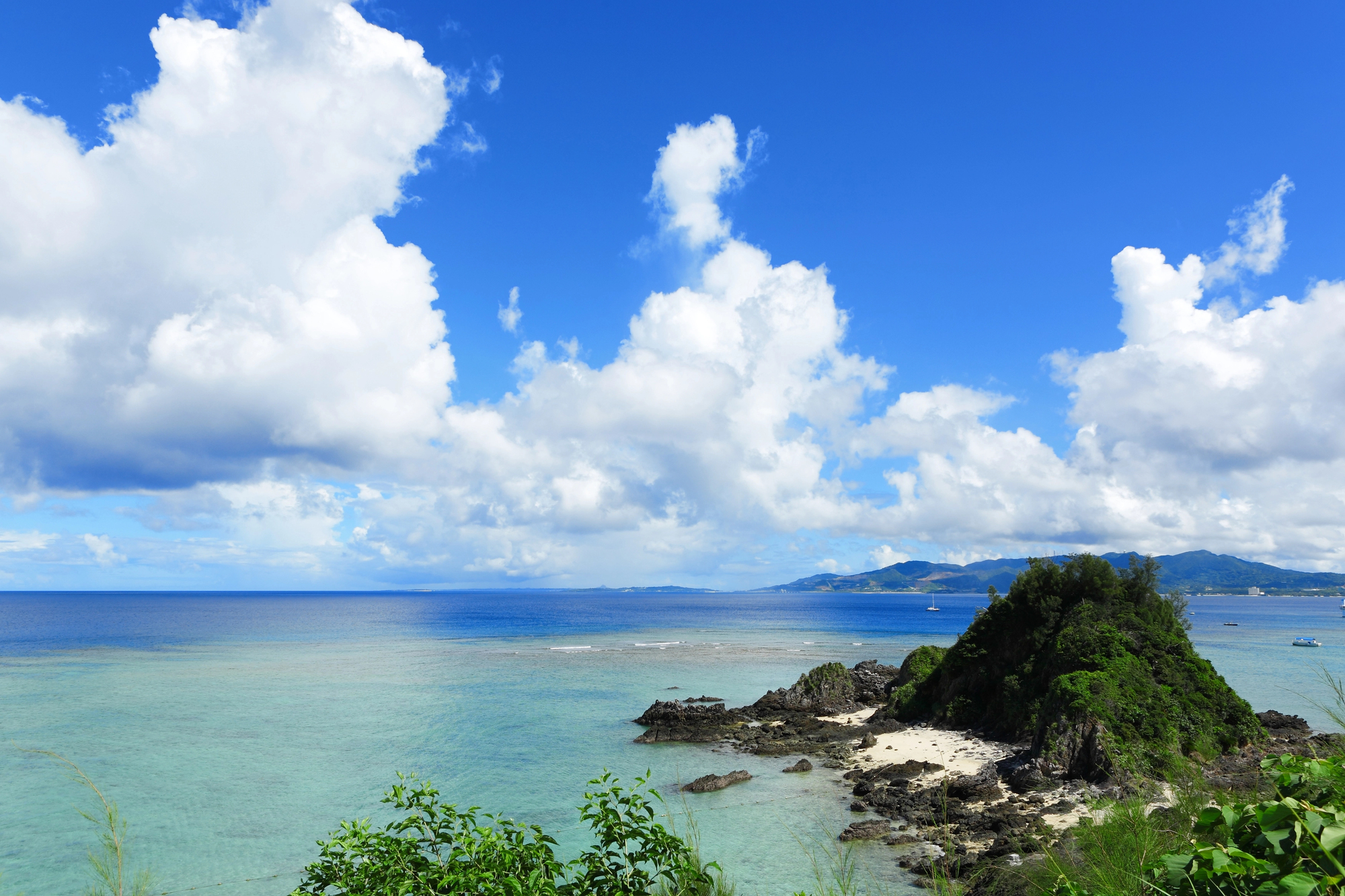 Pristine Okinawa coastline with turquoise waters and tropical landscape